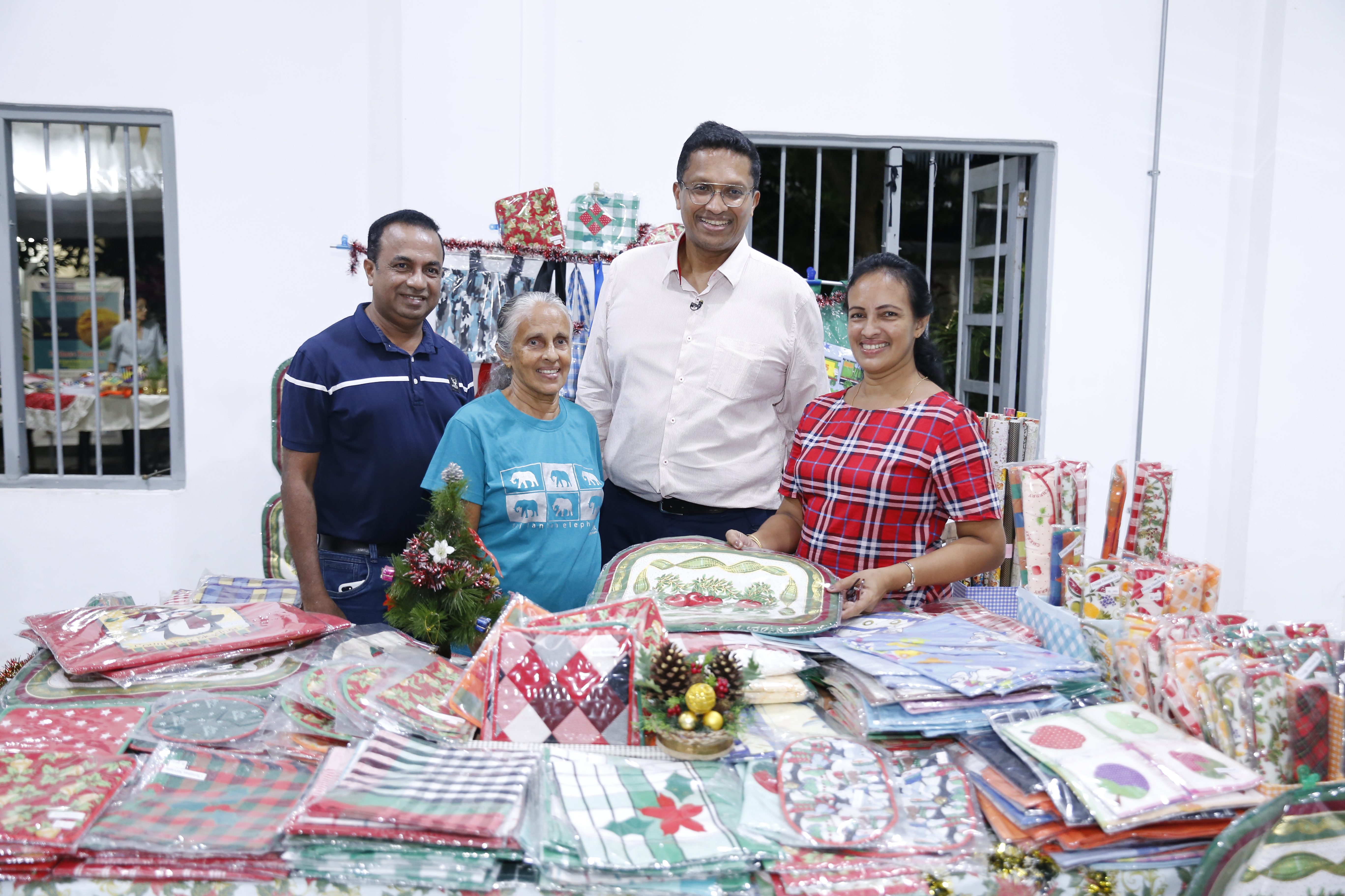 Dilhan Fernando at a local entrepreneur's stand with her and her family